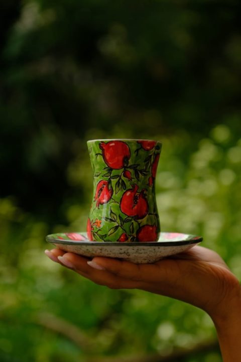 Decorative pear cup with saucer