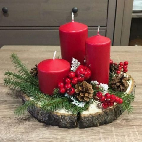 Red candle on wooden decor