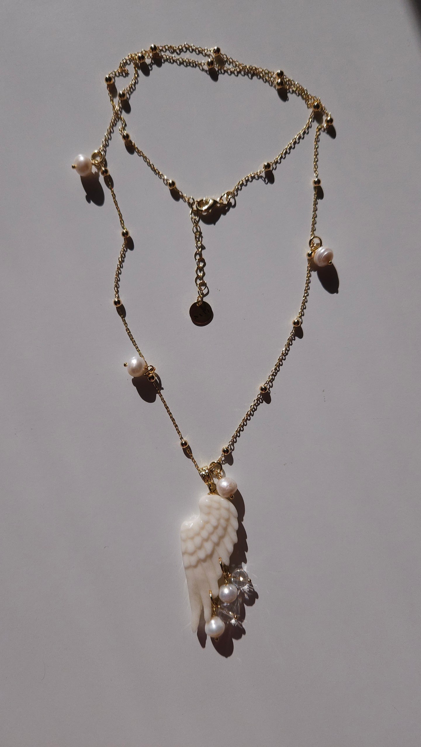 Polimer gildən hazırlanmış əl işi qanad amulet